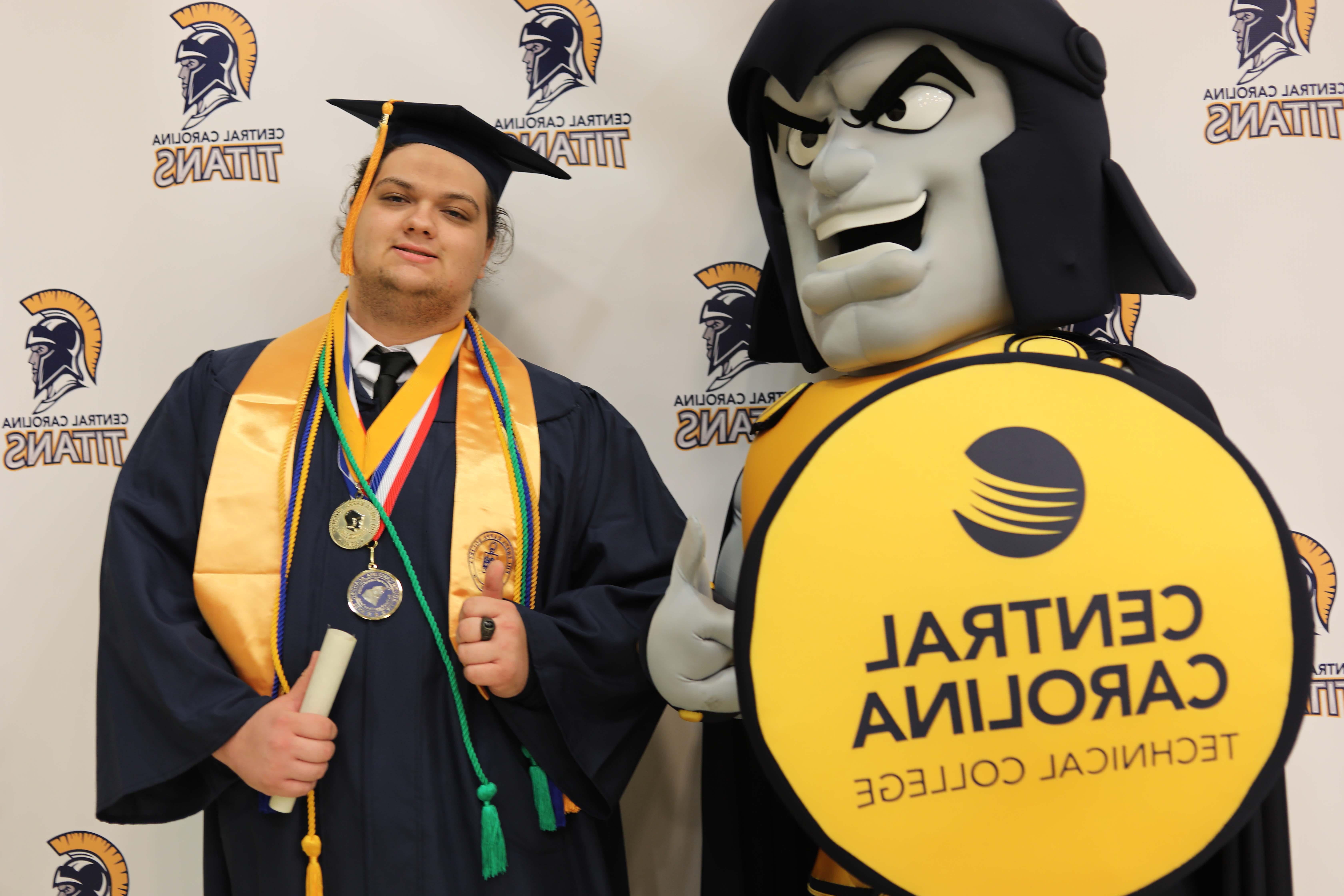 Graduates with Titan Mascot